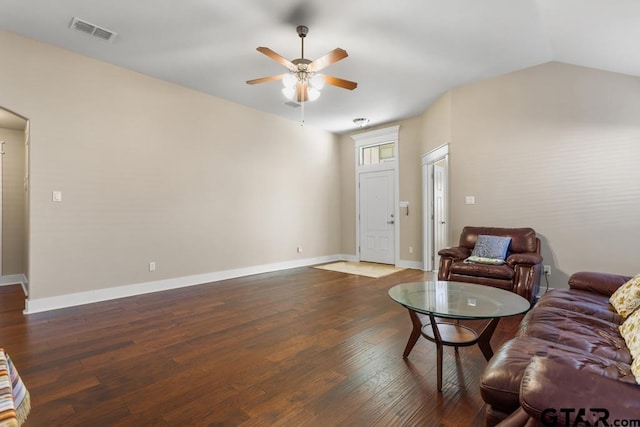 living room featuring dark hardwood / wood-style flooring, ceiling fan, and lofted ceiling