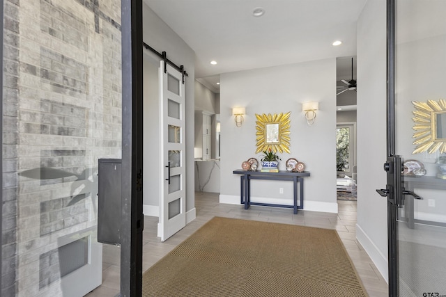 hallway featuring a barn door