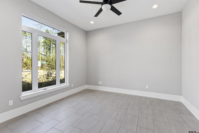 spare room with ceiling fan