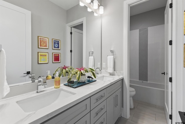 full bathroom featuring vanity, shower / washtub combination, tile patterned floors, and toilet