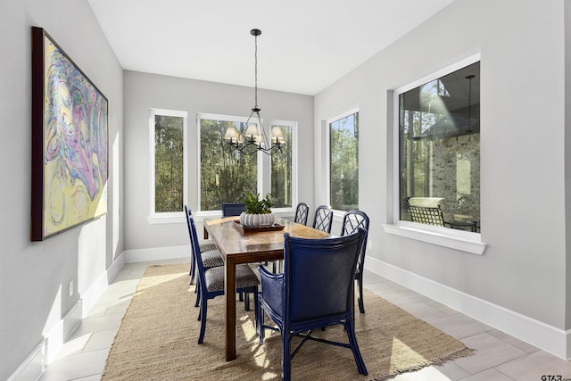 dining space with a chandelier