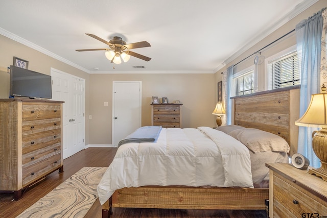 bedroom with ceiling fan, crown molding, and dark hardwood / wood-style flooring