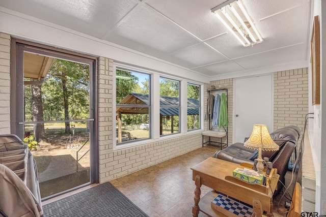 sunroom / solarium featuring plenty of natural light