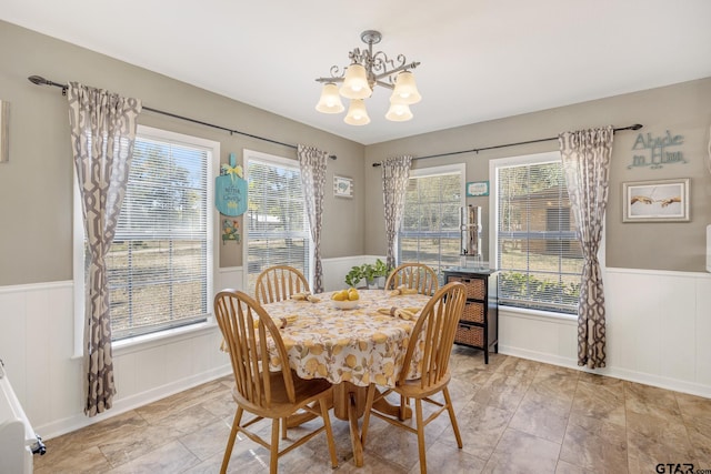 dining area with a notable chandelier and plenty of natural light