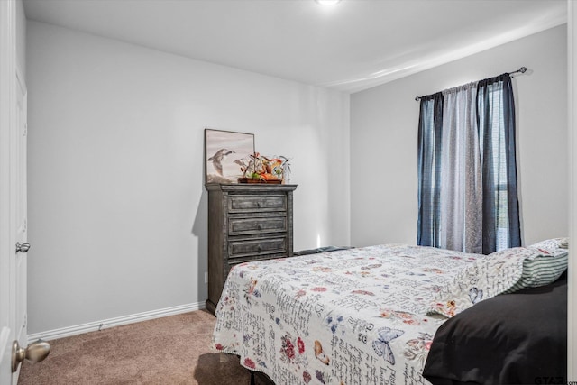 bedroom featuring carpet flooring and baseboards