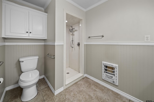 bathroom with toilet, ornamental molding, heating unit, and a shower