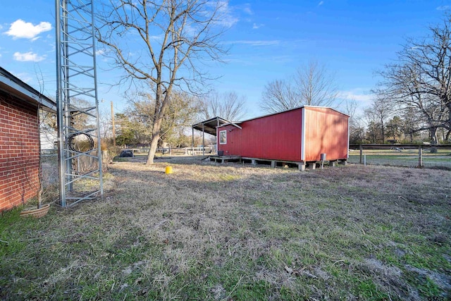 view of yard with a storage unit