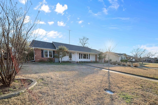 ranch-style house with a front lawn