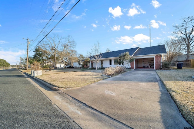 single story home with a garage and a front yard