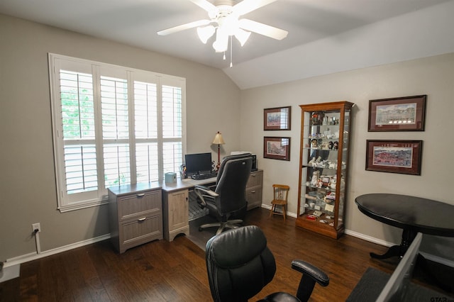 office space with vaulted ceiling, baseboards, a ceiling fan, and dark wood-style floors