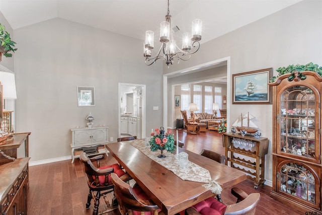 18400 Woodhollow Dr, Flint, TX 75762 - dining space featuring a chandelier, wood finished floors, high vaulted ceiling, and baseboards