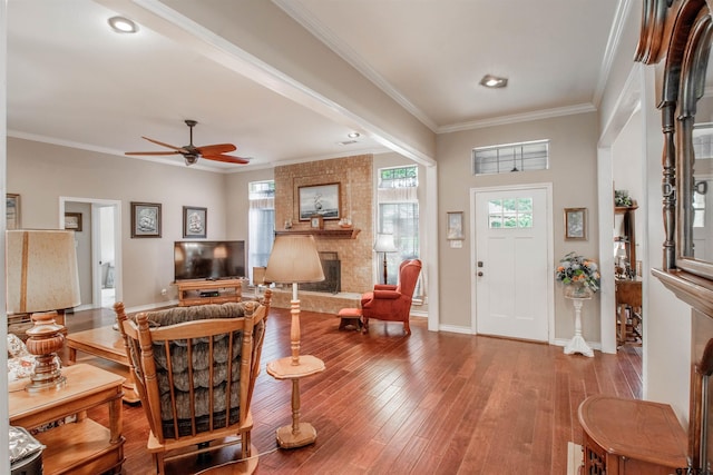 18400 Woodhollow Dr, Flint, TX 75762 - living room featuring a ceiling fan, a fireplace, crown molding, hardwood / wood-style floors, and baseboards