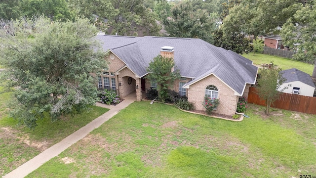 18400 Woodhollow Dr, Flint, TX 75762 - view of front of house featuring brick siding, a shingled roof, and a chimney