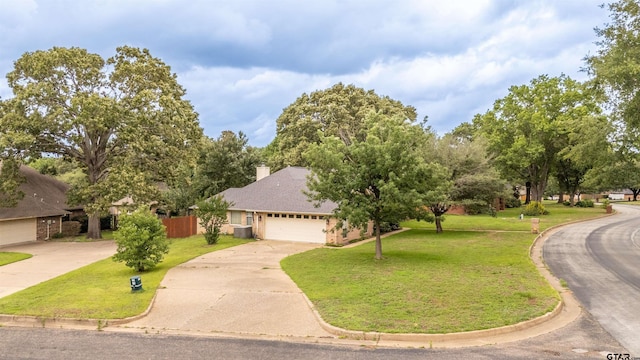18400 Woodhollow Dr, Flint, TX 75762 - view of front facade with concrete driveway, a front yard, an attached garage, and a chimney