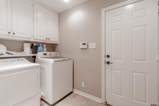 18400 Woodhollow Dr, Flint, TX 75762 - laundry area with washing machine and dryer, cabinet space, baseboards, and light tile patterned flooring