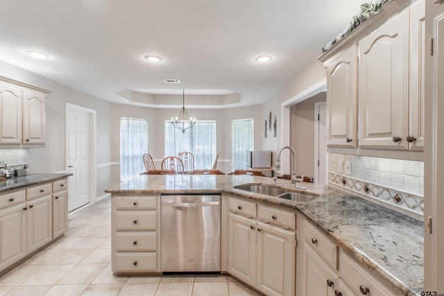 18400 Woodhollow Dr, Flint, TX 75762 - kitchen with dishwasher, a sink, a peninsula, decorative backsplash, and light tile patterned floors