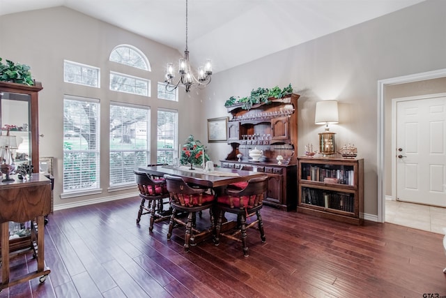 18400 Woodhollow Dr, Flint, TX 75762 - dining room with a chandelier, dark wood-style flooring, vaulted ceiling, and baseboards