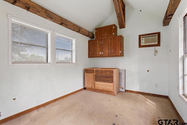 unfurnished room with a wall mounted AC and vaulted ceiling with beams