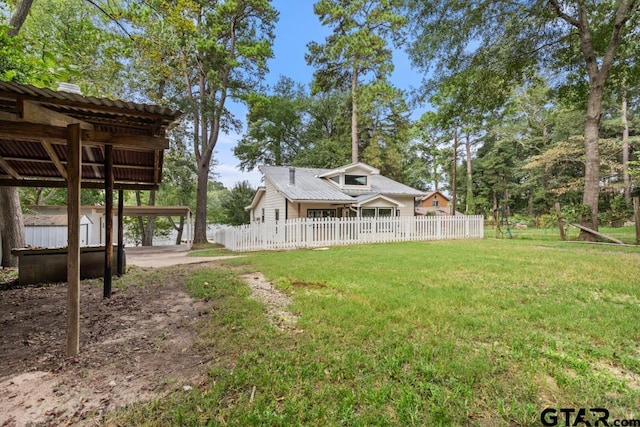 view of yard featuring a carport and a shed