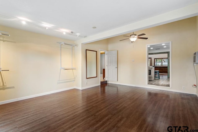 unfurnished room featuring dark wood-type flooring and ceiling fan