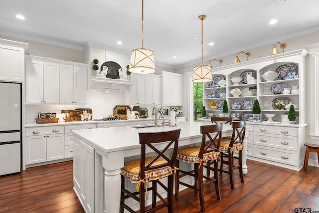 14698 Jade Forest Trl, Tyler, TX 75707 - kitchen featuring open shelves, a sink, light countertops, crown molding, and white refrigerator