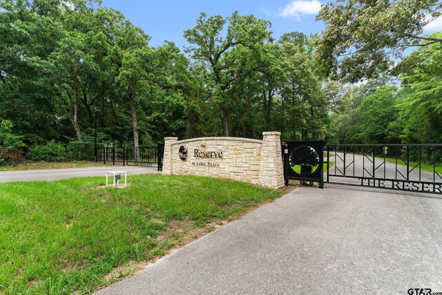 14698 Jade Forest Trl, Tyler, TX 75707 - community / neighborhood sign with a gate