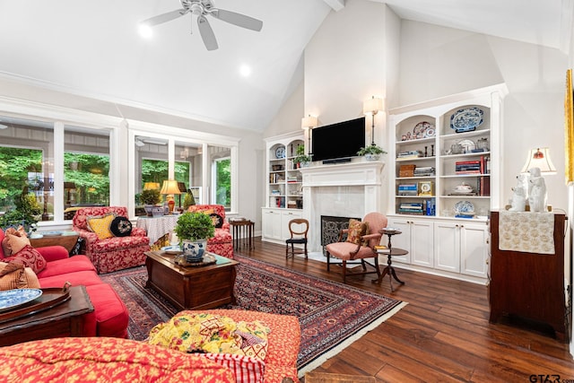 14698 Jade Forest Trl, Tyler, TX 75707 - living room with high vaulted ceiling, ceiling fan, a fireplace, dark wood-style floors, and built in shelves
