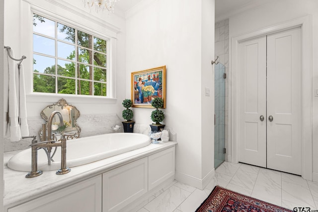 14698 Jade Forest Trl, Tyler, TX 75707 - bathroom featuring marble finish floors, a bath, a stall shower, baseboards, and ornamental molding