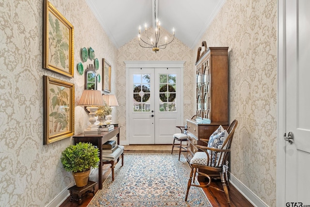 14698 Jade Forest Trl, Tyler, TX 75707 - foyer entrance with wallpapered walls, wood finished floors, a chandelier, ornamental molding, and baseboards