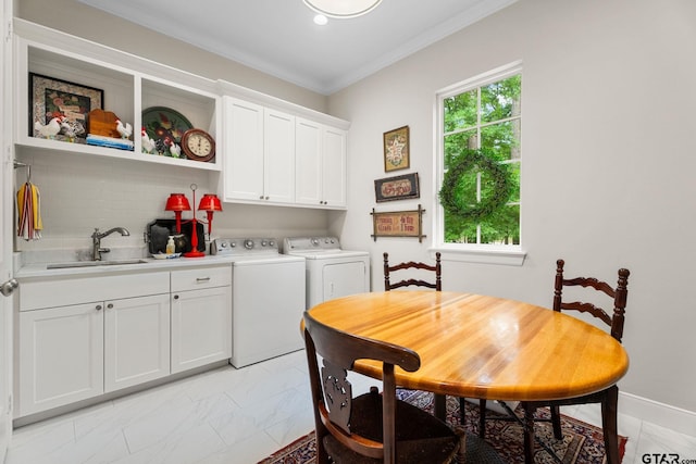 14698 Jade Forest Trl, Tyler, TX 75707 - dining area featuring washer and clothes dryer, light marble finish floors, ornamental molding, and baseboards