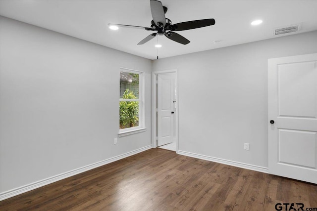 unfurnished room with ceiling fan, recessed lighting, baseboards, wood finished floors, and visible vents