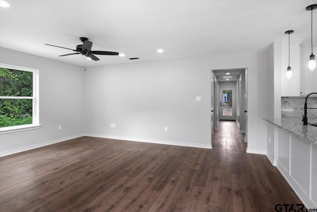 empty room with visible vents, baseboards, dark wood-style floors, recessed lighting, and a ceiling fan