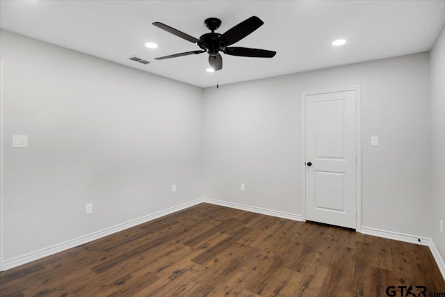 unfurnished room featuring ceiling fan, dark wood finished floors, recessed lighting, baseboards, and visible vents