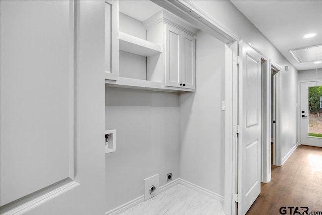 laundry area featuring cabinet space, hookup for a washing machine, attic access, electric dryer hookup, and baseboards