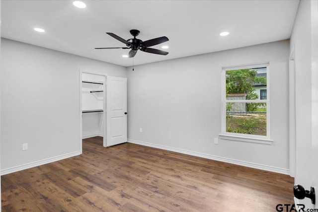 unfurnished bedroom with baseboards, recessed lighting, dark wood-style flooring, and ceiling fan