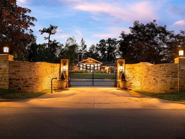 view of gate at dusk