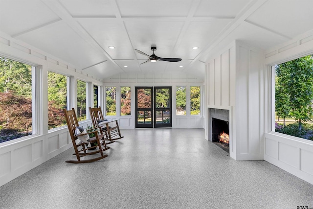 sunroom with french doors, lofted ceiling, ceiling fan, and a healthy amount of sunlight