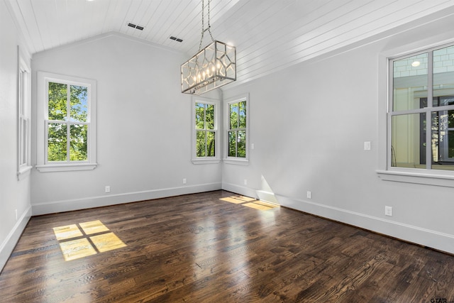 unfurnished room with dark hardwood / wood-style flooring, plenty of natural light, lofted ceiling, and a notable chandelier