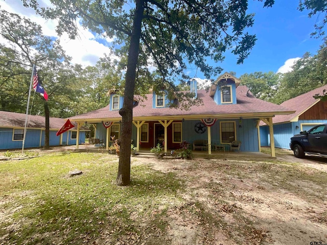 view of front facade with a porch and a front yard