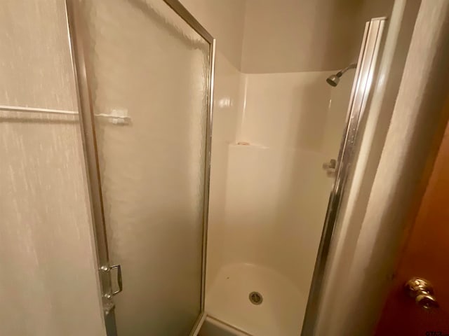 bathroom featuring an enclosed shower