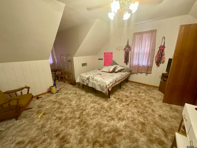 bedroom with ceiling fan, a textured ceiling, vaulted ceiling, and carpet floors