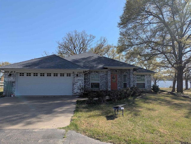 22812 Coffee Lndg, Frankston, TX 75763 - ranch-style home with an attached garage, concrete driveway, a front yard, a shingled roof, and brick siding