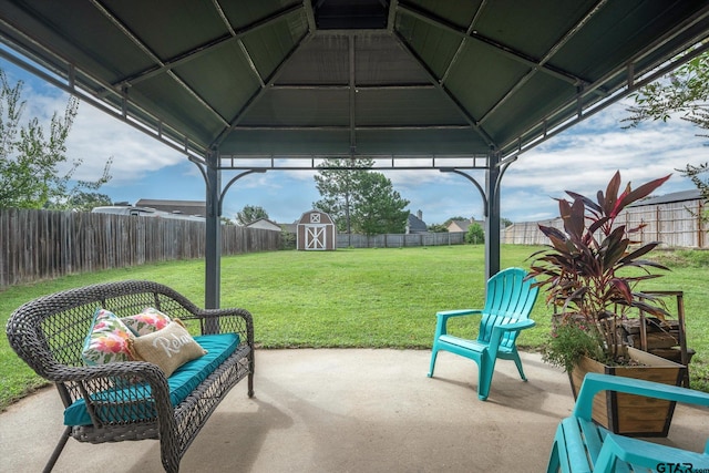 view of patio / terrace with a gazebo and a storage unit