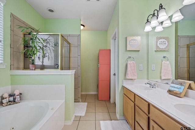 bathroom with tile patterned floors, vanity, and shower with separate bathtub