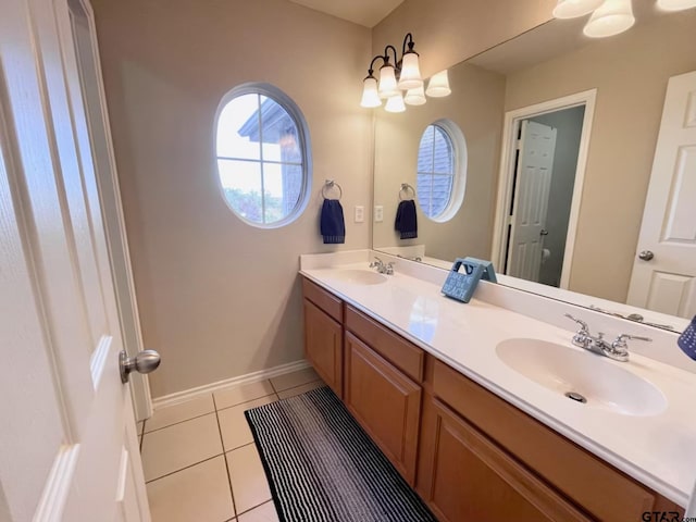 bathroom with tile patterned flooring and vanity