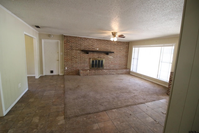 unfurnished living room featuring a fireplace, a textured ceiling, dark carpet, and ceiling fan