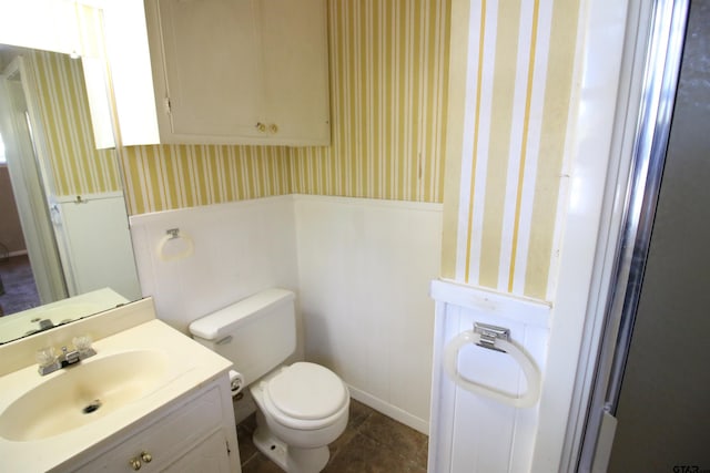 bathroom with vanity and toilet