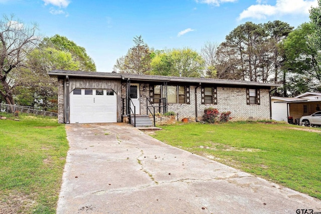 ranch-style house featuring a garage and a front yard