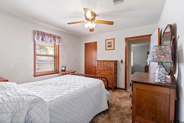 bedroom with carpet floors, ceiling fan, and a closet