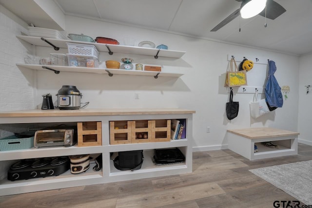 mudroom with baseboards, a ceiling fan, and wood finished floors